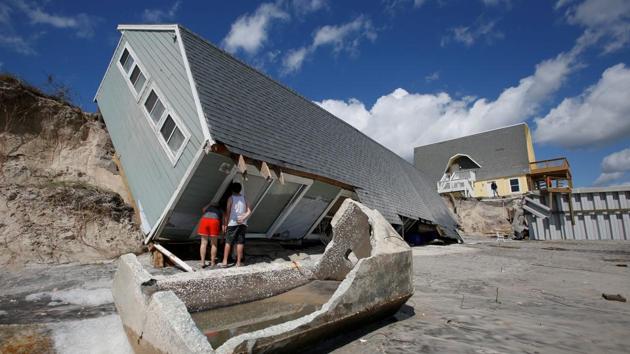 Locals look inside a collapsed coastal house after Hurricane Irma passed Vilano Beach, Florida, on September 12. (Reuters File Photo) Locals look inside a collapsed coastal house after Hurricane Irma passed Vilano Beach, Florida, on September 12. (Reuters File Photo)