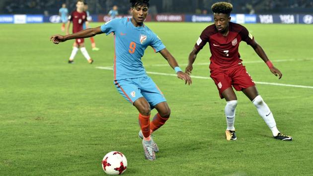 Aniket Jadhav of India and Cris Gloster of USA in action during the FIFA U- 17 World Cup match at Jawaharlal Nehru Stadium in New Delhi, India, on Friday. (Mohd Zakir/HT PHOTO) Aniket Jadhav of India and Cris Gloster of USA in action during the FIFA U- 17 World Cup match at Jawaharlal Nehru Stadium in New Delhi, India, on Friday. (Mohd Zakir/HT PHOTO)