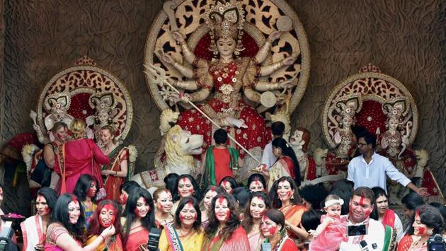 Trinamool Congress MP & film actress Moon Moon Sen is seen with other film actresses taking part in ‘Sindur Khela’ in front of a Goddess Durga idol at a puja pandal in Kolkata. (Ashok Bhaumik / PTI) Trinamool Congress MP & film actress Moon Moon Sen is seen with other film actresses taking part in ‘Sindur Khela’ in front of a Goddess Durga idol at a puja pandal in Kolkata. (Ashok Bhaumik / PTI)