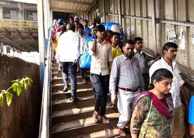 People in queue on the steps of the bridge, where the stampede had occurred a week ago, on Friday. (Anshuman Poyrekar/HT Photo) People in queue on the steps of the bridge, where the stampede had occurred a week ago, on Friday. (Anshuman Poyrekar/HT Photo)