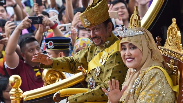 Brunei's Sultan Hassanal Bolkiah and Queen Saleha ride in a royal chariot during a procession to mark his golden jubilee of accession to the throne in Bandar Seri Begawan. (Rosian Rahman / AFP) Brunei's Sultan Hassanal Bolkiah and Queen Saleha ride in a royal chariot during a procession to mark his golden jubilee of accession to the throne in Bandar Seri Begawan. (Rosian Rahman / AFP)