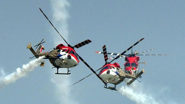Indian Air Force’s ‘Sarang’ Helicopter Aerobatic team displaying maneuvers during the 85th Air Force Day parade at Hindon Air Force base in Ghaziabad. (Sushil Kumar / HT Photo)