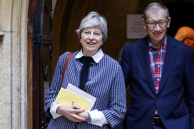 British Prime Minister Theresa May and her husband Philip May after attending the Sunday morning service at a church on October 8, 2017. (AFP) British Prime Minister Theresa May and her husband Philip May after attending the Sunday morning service at a church on October 8, 2017. (AFP)