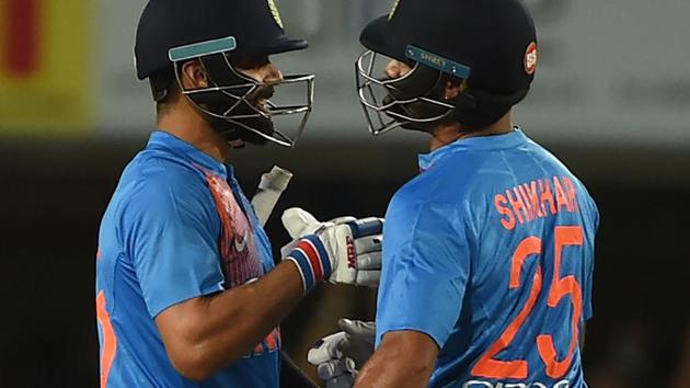 Indian cricket team captain Virat Kohli (L) and Shikhar Dhawan celebrate after beating Australia cricket team in the first T20I at The JSCA International Stadium in Ranchi on Saturday. Spinner Kuldeep Yadav led an inspired bowling effort to help India beat Australia by nine wickets in the rain-shortened first Twenty20 international.(AFP)