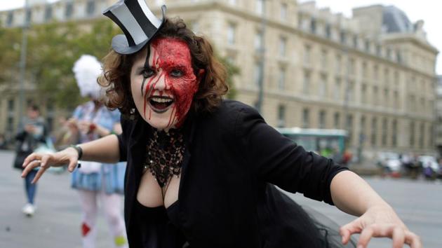 A participant attends the ‘Zombie Walk’ in Paris. The walks are now used to raise money for charity. (AFP)