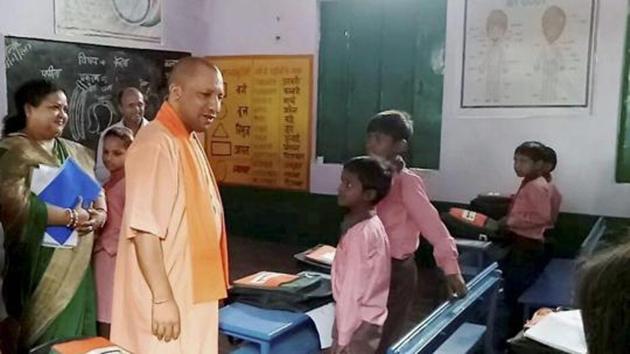 Uttar Pradesh chief minister Yogi Adityanath interacts with school children at a school at Brijghat in Amroha.(PTI File Photo) Uttar Pradesh chief minister Yogi Adityanath interacts with school children at a school at Brijghat in Amroha.(PTI File Photo)