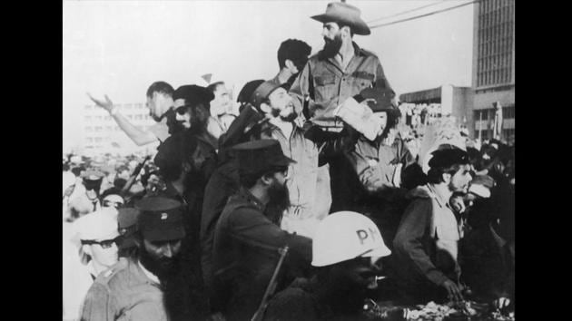 Cuban President Fidel Castro (centre) is seen arriving in Havana with Che Geuvara (R) on December 1, 1959. The duo had met five years earlier in Mexico City and eventually led the Cuban revolution of 1959, which saw Castro’s removal of Fulgencio Batista as the country’s head of state. (Keystone / Getty Images)
