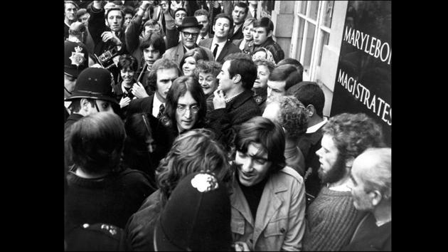 Lennon and Yoko Ono had their run-ins with the law as seen here in October 1968, when they arrived outside the Marylebone Magistrates Court, London on two charges; the illegal possession of cannabis and obstructing police in the execution of a search warrant. (Bob Aylott / Keystone / Getty Images)
