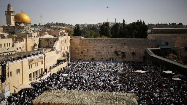 A general view shows Jewish worshippers taking part in the priestly blessing at the Western Wall of Judaism’s holiest prayer site in the Old City. Sukkot is agriculturally a harvest festival, also known as Chag Ha-Asif meaning the ‘festival of gathering.’ (Amir Cohen / REUTERS)