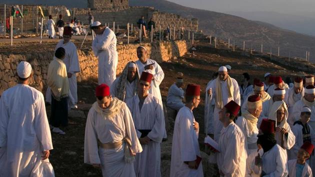 Samaritans are seen during the Sukkot festival. Evangelical Christianity is one of the fastest growing religious movements with belief in an era in the future when all nations of the earth will flock to Jerusalem. Jews and Christians both believe in such a Messianic age, though Jews do not accept the Christian belief that Jesus is the Messiah. (Jaffar Ashtiyeh / AFP)