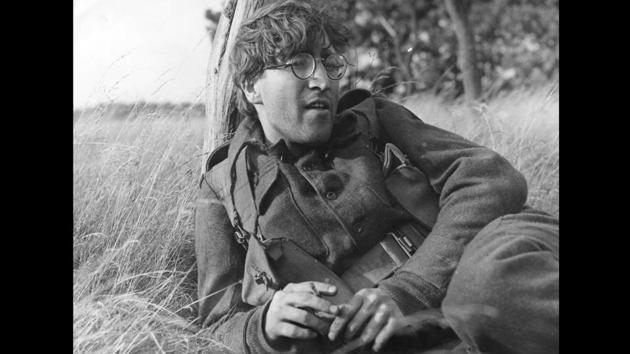 In 1966, John Lennon took some time off from ‘The Beatles’ to play a young soldier, ‘Private Gripweed,’ in Richard Lester’s film ‘How I Won the War’, which was shot on location in Germany and Spain. During filming, Lennon started wearing round ’granny’ glasses, which later became one of his most distinctive identifiers. (Keystone / Getty Images)