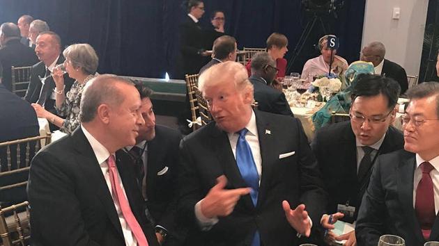 Turkey's President Recep Tayyip Erdogan (left) listens to US President Donald Trump during a dinner at UN headquarters on September 19.(AP File)