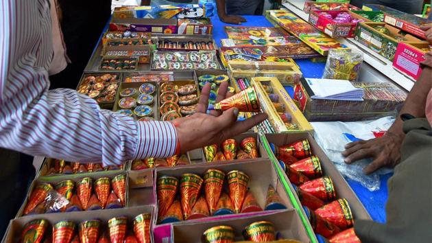 The police were undecided on how to react to people bursting crackers as the court order does not call it an illegal act. (PTI) The police were undecided on how to react to people bursting crackers as the court order does not call it an illegal act. (PTI)