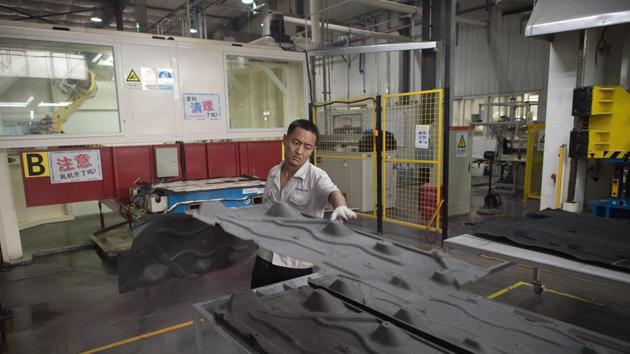 A worker at the American Industrial Park in Shenyang. Analysts in China expect that full-year growth would meet or exceed the government’s target. (AFP file photo) A worker at the American Industrial Park in Shenyang. Analysts in China expect that full-year growth would meet or exceed the government’s target. (AFP file photo)