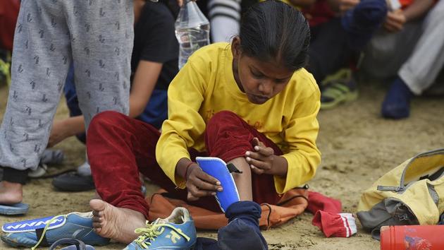 At eight, Asha already knows what a football injury feels like. At ‘My Angels Academy’ in Vikaspuri, she’s among several young boys and girls who’re taught to play football properly, with a strong focus on technique, stamina and attitude. (RAJ K RAJ / HT PHOTO)