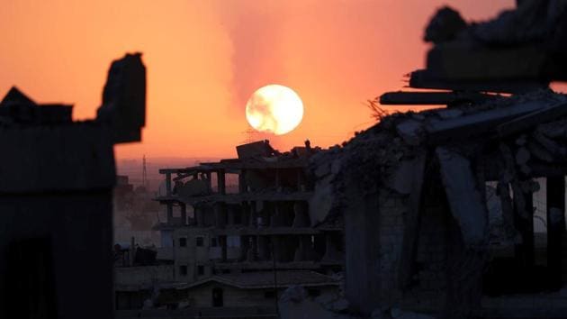 Destroyed buildings are pictured during sunset in Raqqa. Both the US spokesman Dillon and the SDF fighter Babel say that some Islamic State fighters are surrendering. Interrogations of those surrendering reveal ISIS had dug a tunnel between the hospital and stadium. At the front line, morale among SDF fighters remains high. One fighter for instance belted pop music to other units over his walkie talkie. The battle is expected to last between seven to 10 days. (Erik De Castro / REUTERS) Destroyed buildings are pictured during sunset in Raqqa. Both the US spokesman Dillon and the SDF fighter Babel say that some Islamic State fighters are surrendering. Interrogations of those surrendering reveal ISIS had dug a tunnel between the hospital and stadium. At the front line, morale among SDF fighters remains high. One fighter for instance belted pop music to other units over his walkie talkie. The battle is expected to last between seven to 10 days. (Erik De Castro / REUTERS)