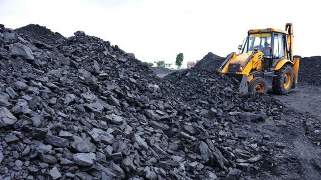 Labourers unload coal with the help of a crane at a coal field on the outskirts of Hyderabad. (AFP File Photo) Labourers unload coal with the help of a crane at a coal field on the outskirts of Hyderabad. (AFP File Photo)