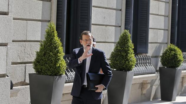 Prime Minister Mariano Rajoy waves on arrival at the Spanish parliament in Madrid on Wednesday. (AP) Prime Minister Mariano Rajoy waves on arrival at the Spanish parliament in Madrid on Wednesday. (AP)