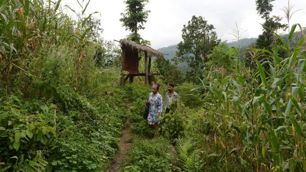 Monika Shahi Nath Yogi and her husband Ramesh Nath Yogi walk in their village in Nepal's Dadeldhura district. Yogi’s family were initially resistant to the marriage, but the community has now accepted the couple. (Prakash Mathema / AFP)