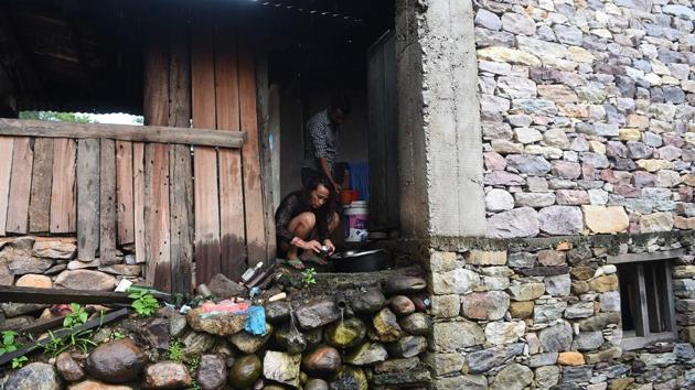 Monika has settled into the village and in her new home, seen doing household chores here. Although a bill to legalise same-sex marriage was proposed two years ago, there hasn’t been much progress and legally it’s not clear if Nath’s marriage will hold its own in a court of law. (Prakash Mathema / AFP)