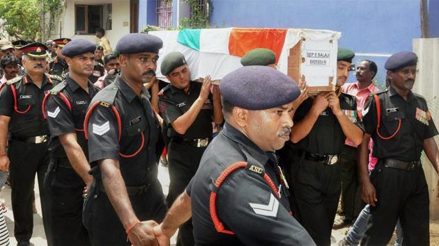 Army personnel carrying the coffin of Sepoy E Balaji, who was killed in an Indian Air Force helicopter crash in Arunachal Pradesh, during his last rites at Kolapakkam, Chennai on Monday. (PTI) Army personnel carrying the coffin of Sepoy E Balaji, who was killed in an Indian Air Force helicopter crash in Arunachal Pradesh, during his last rites at Kolapakkam, Chennai on Monday. (PTI)