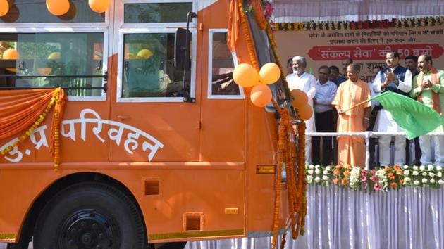 UP Chief Minister Yogi Adityanath flags off new saffron bus in Lucknow, on Wednesday.(Subhankar Chakraborty/ Hindustan Times) UP Chief Minister Yogi Adityanath flags off new saffron bus in Lucknow, on Wednesday.(Subhankar Chakraborty/ Hindustan Times)
