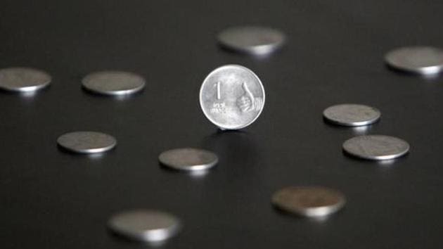 An Indian one rupee coin is seen in this picture illustration taken in Mumbai April 30, 2012. REUTERS/Vivek Prakash/Files An Indian one rupee coin is seen in this picture illustration taken in Mumbai April 30, 2012. REUTERS/Vivek Prakash/Files