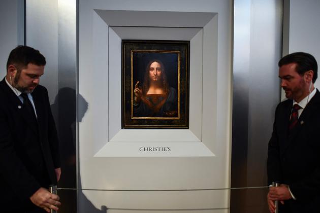 Security personnel stand next to Leonardo da Vinci's Salvator Mundi after it was unveiled at Christie's in New York on October 10, 2017. (AFP) Security personnel stand next to Leonardo da Vinci's Salvator Mundi after it was unveiled at Christie's in New York on October 10, 2017. (AFP)