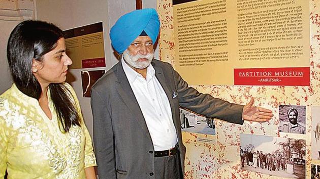 Pushpinder Singh Chopra, son of Brigadier Mohindar Singh Chopra, and Partition Museum CEO Malika Ahluwalia next to photos of the brigadier and others related to the India-Pakistan border demarcation, in Amritsar on Wednesday. (HT Photo) Pushpinder Singh Chopra, son of Brigadier Mohindar Singh Chopra, and Partition Museum CEO Malika Ahluwalia next to photos of the brigadier and others related to the India-Pakistan border demarcation, in Amritsar on Wednesday. (HT Photo)