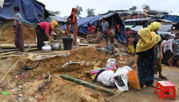Rohingya refugees dismantle their makeshift home to move to another camp at the Palangkhali refugee camp in Ukhia district on October 12, 2017. (AFP) Rohingya refugees dismantle their makeshift home to move to another camp at the Palangkhali refugee camp in Ukhia district on October 12, 2017. (AFP)