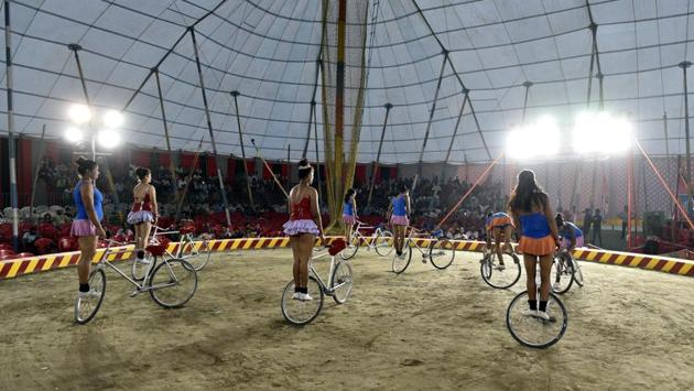 Women perform balancing acts on bicycles as part of Asiad Circus’ lineup of acts. Many believe that the Indian circus has failed to reinvent itself, depending on the age-old trapeze, juggling and gymnastics performances. (Sanchit Khanna / HT PHOTO)