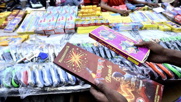 Firecrackers are on sale at Bhagirath Palace market in New Delhi despite a ban by Supreme Court.(Arun Sharma/HT Photo)
