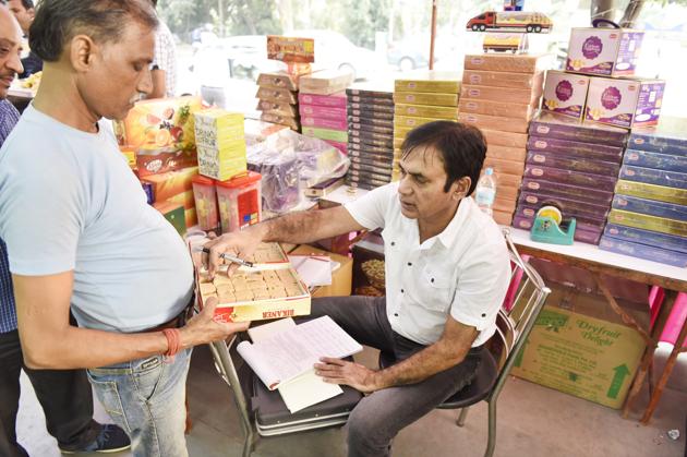 KK Sharma, Gurgaon’s food safety officer, checks samples at a sweet shop on Thursday. (Sanjeev Verma/HT PHOTO) KK Sharma, Gurgaon’s food safety officer, checks samples at a sweet shop on Thursday. (Sanjeev Verma/HT PHOTO)
