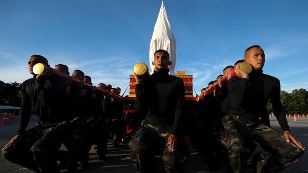 Army officers take part in a funeral rehearsal for the late king in Bangkok. Thai royalists have described the loss as equivalent to the nation’s Mandela, or Princess Diana moment. One royalist encapsulated the people’s emotions saying ‘What the world will see is rivers of tears that show how much Thais love King Bhumibol Adulyadej.’ (Athit Perawongmetha / REUTERS) Army officers take part in a funeral rehearsal for the late king in Bangkok. Thai royalists have described the loss as equivalent to the nation’s Mandela, or Princess Diana moment. One royalist encapsulated the people’s emotions saying ‘What the world will see is rivers of tears that show how much Thais love King Bhumibol Adulyadej.’ (Athit Perawongmetha / REUTERS)
