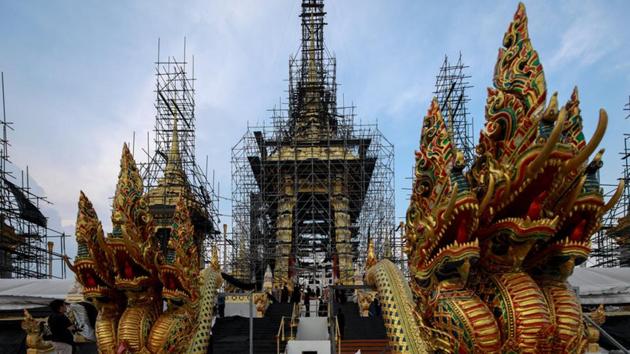 Deity sculptures which will be used at the Royal Crematorium for the late King Bhumibol Adulyadej are seen in Bangkok. Among the many royal objects restored for the funeral is a golden chariot that will carry the king’s body in a giant ornate urn to the cremation site. The urn will move to the Royal Crematorium before the cremation, which has been declared a national holiday. (Athit Perawongmetha / REUTERS) Deity sculptures which will be used at the Royal Crematorium for the late King Bhumibol Adulyadej are seen in Bangkok. Among the many royal objects restored for the funeral is a golden chariot that will carry the king’s body in a giant ornate urn to the cremation site. The urn will move to the Royal Crematorium before the cremation, which has been declared a national holiday. (Athit Perawongmetha / REUTERS)