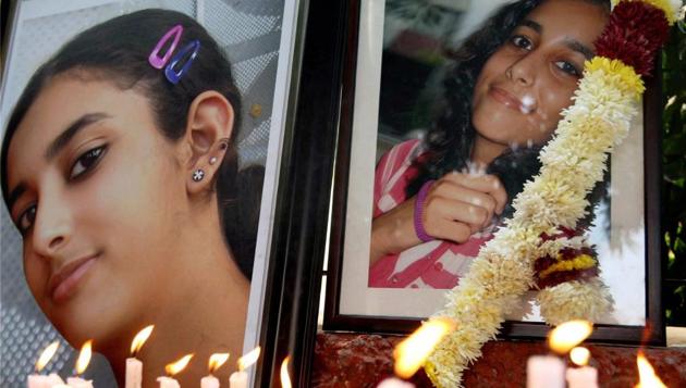 In this file photo friends and relatives of Aarushi Talwar light candles near her portrait to seek justice for her, at Jantar Mantar in New Delhi in Jan, 2016.(PTI)
