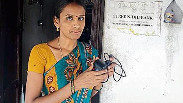 With no ATMs, villagers make do with the facility called Stree Nidhi Bank to withdraw money. The facility is run by S Devalatha (pic) to assist women self-help groups.(HT Photo)
