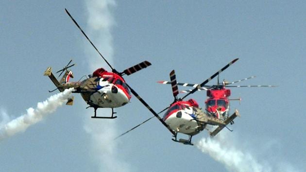 Indian Air Force’s ‘Sarang’ Helicopter Aerobatic team displaying maneuvers during the 85th Air Force Day parade at Hindon Air Force base in Ghaziabad. (Sushil Kumar / HT Photo)