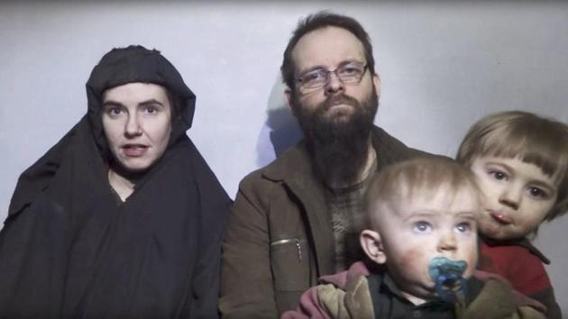 In this image from a video released by the Taliban in December 2016, Caitlan Coleman talks while her Canadian husband Joshua Boyle holds their two children. US officials said Pakistan secured the release of Coleman and her husband, who were abducted five years ago while travelling in Afghanistan and were held by the Haqqani Network. The couple had three children while in captivity, and all have been freed. (AP) In this image from a video released by the Taliban in December 2016, Caitlan Coleman talks while her Canadian husband Joshua Boyle holds their two children. US officials said Pakistan secured the release of Coleman and her husband, who were abducted five years ago while travelling in Afghanistan and were held by the Haqqani Network. The couple had three children while in captivity, and all have been freed. (AP)