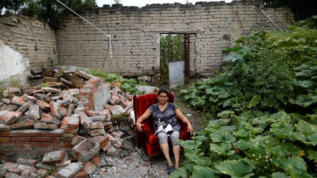 Teresa Luna, 49, a seamstress, poses for a portrait with her dog Dokie, next to a portion of her damaged house. ‘The most valuable thing that I recovered was my dog,’ Luna said. She is living in her backyard and hopes to return when the damage is repaired. At least 369 people died in the 7.1 magnitude quake that hit central Mexico, causing more devastation in the capital than any since the 1985 disaster that killed thousands. (Edgard Garrido / REUTERS)