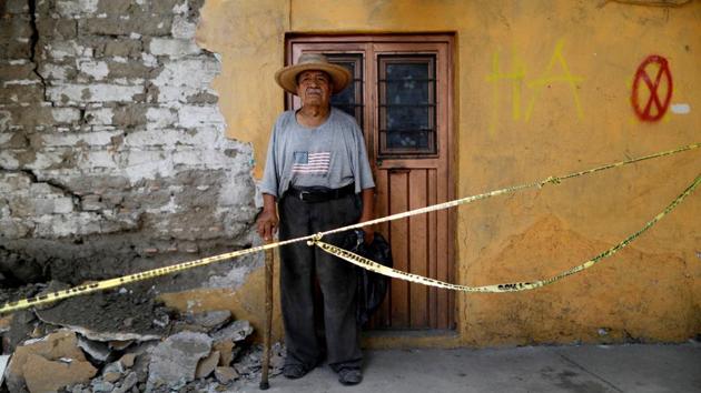 Luis Garcia, 79, a bricklayer, stands outside a house that he built, after the earthquake in Jojutla de Juarez, Mexico. The sign reads, ‘HA’ which means habitable. ‘No house that I built was damaged by the earthquake,’ Garcia said. Thousands of homes were damaged or destroyed in the quake, which followed another major tremor in the southwest of Mexico two weeks earlier that displaced thousands of people. (Edgard Garrido / REUTERS)