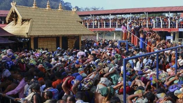 In this Dec. 1, 2015 photo, worshippers queue during a pilgrimage at the Sabarimala temple. (AP File Photo) In this Dec. 1, 2015 photo, worshippers queue during a pilgrimage at the Sabarimala temple. (AP File Photo)