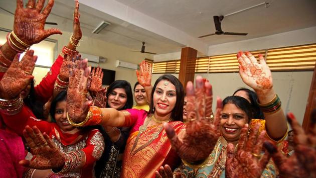 On October 8, married women displayed their hands decorated with henna while they danced during celebrations to mark the Hindu festival of Karva Chauth, in Chandigarh. (Ajay Verma / Reuters)