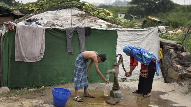 The refugees in Delhi collect water for daily use at their camp at Shaheen Bagh. Majority of the population in India are concentrated around states of Jammu &Kashmir, Telangana, Haryana, Uttar Pradesh, Delhi, and Rajasthan. These camps often lack basic amenities like drinking water and sanitation. (Burhaan Kinu / HT PHOTO)