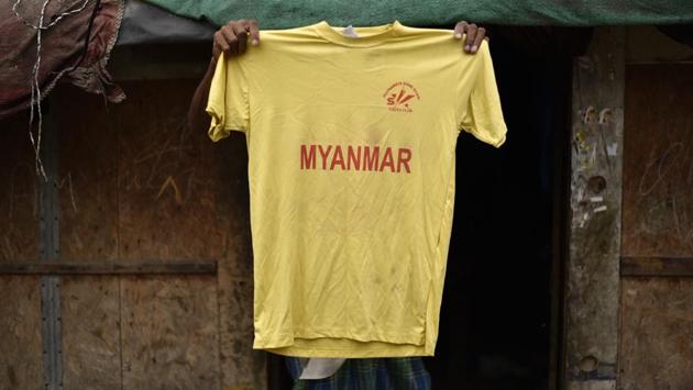 A man holds up his son’s football club t-shirt in a Rohingya refugee camp in New Delhi. The club, called ‘Rohingya Shining Stars’, has seventeen boys from the camp who love football. As the refugees’ fate in India hangs uncertain, they will hope for some relief as the Supreme Court hears their case today on the Indian government’s stand to deport them. (Burhaan Kinu / HT PHOTO)