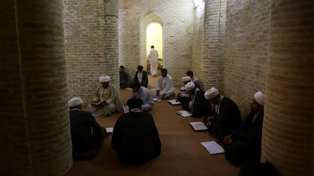Shi’ite clerics study at al-Sayed al-Yazdi school run by the Hawza al-Ilmiyya in Najaf, Iraq. The Karbala school teaches around 250 students each year, and in Najaf there are more than 1000. Together they are served by a faculty of around 90 teachers. (Abdullah Dhiaa Al-deen / REUTERS)