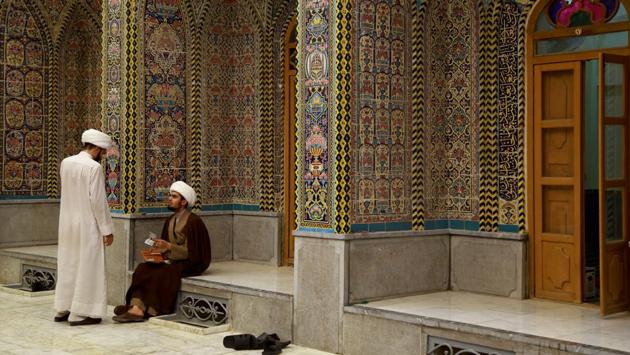 Shi'ite clerics talk at al-Sayed al-Yazdi school run by the Hawza al-Ilmiyya in Najaf, Iraq. Following a slump in enrolments during the Saddam regime, the Najaf Hawza and its schools, under the chancellorship of Ayatollah Sistani host around 13,000 students. The curriculum has also seen updates to include modern subjects as well as inter faith and inter sectarian initiatives. (Abdullah Dhiaa Al-deen / REUTERS)