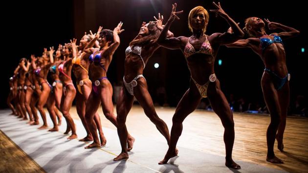 In this picture from October 9, 2017, Japanese women body builders pose during the Japan body building championships in Tokyo. The number of body builders registered with Japan's national federation has almost doubled over the past six years to around 3,000, with women making up 10 percent as part of a nationwide fitness boom, officials said. (Behrouz Mehri / AFP) In this picture from October 9, 2017, Japanese women body builders pose during the Japan body building championships in Tokyo. The number of body builders registered with Japan's national federation has almost doubled over the past six years to around 3,000, with women making up 10 percent as part of a nationwide fitness boom, officials said. (Behrouz Mehri / AFP)