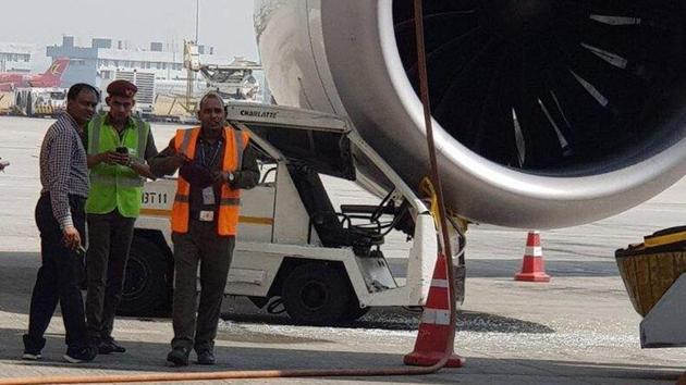 Electric baggage tractor hits engine of a Shanghai-bound Air India flight. (Twitter/ANI Photo) Electric baggage tractor hits engine of a Shanghai-bound Air India flight. (Twitter/ANI Photo)