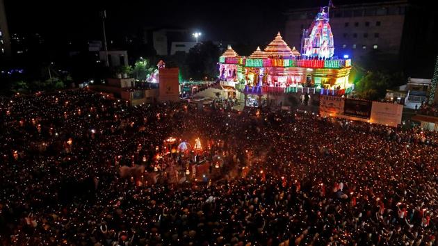 Navratri  celebrations in Surat. Since the imposition of the act, the owners of land and other immovable properties will have to seek the collector’s permission before selling their assets. (REUTERS)